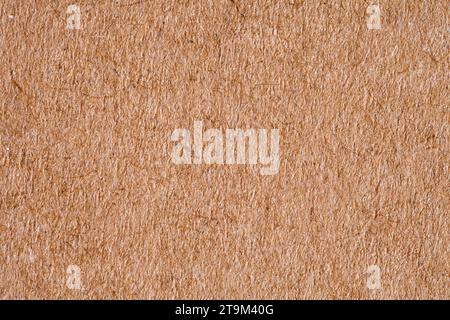 Paper is rough old orange, background structure, close-up macro view Stock Photo