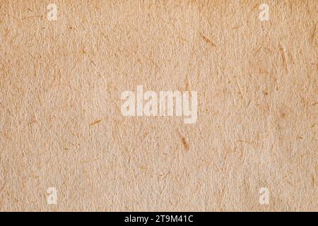 Paper is rough old orange, background structure, close-up macro view Stock Photo