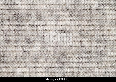 Wool yarn made of white threads, background structure, close-up macro view Stock Photo