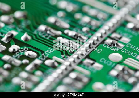 Printed electronic board with elements, green, close-up macro view, selective focus Stock Photo