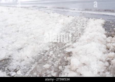 Bavaria, Germany - November 26, 2023: Snow and ice on a road. Slippery road *** Schnee und Eis auf einer Straße. Glatte Fahrbahn Stock Photo