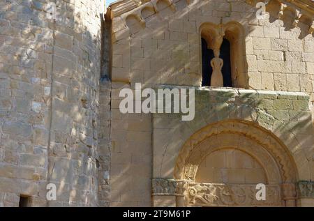 Detail on exterior of Corsignano, the simple 12th-century Romanesque stone church where popes Pius II & Pius III were baptized, Pienza, Italy Stock Photo