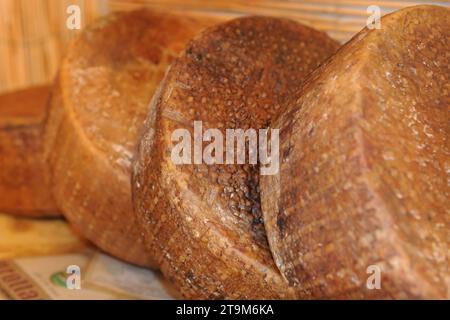 Pienza, Italy - Pecorino sheep cheese aged between 10-20 days for sale in a shop in the medieval village of Pienza, Tuscany Stock Photo