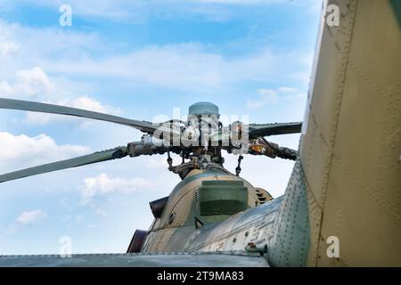 Old Soviet-made camouflage Mi-24 military helicopter propeller Stock Photo