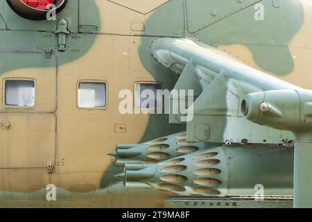 Old Soviet-made camouflage Mi-24 military helicopter rocket pods Stock Photo