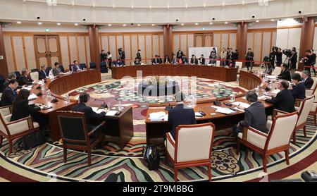 Busan, South Korea. 26th Nov, 2023. Chinese Foreign Minister Wang Yi, also a member of the Political Bureau of the Communist Party of China Central Committee, attends the tenth trilateral foreign ministers' meeting between China, Japan and South Korea with South Korean Foreign Minister Park Jin and Japanese Foreign Minister Yoko Kamikawa in Busan, South Korea, Nov. 26, 2023. Credit: Yao Qilin/Xinhua/Alamy Live News Stock Photo