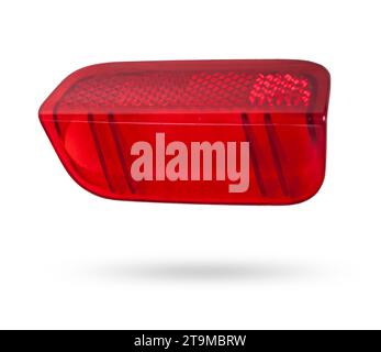 A  transparent plastic red shade for illuminating the interior on a white isolated background in a photo studio - spare parts for repairing a car inte Stock Photo