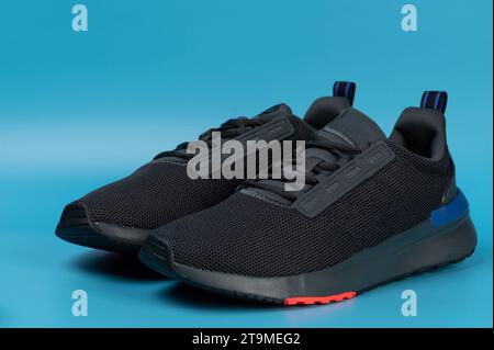 Pair of sport mesh shoes front view isolated on blue studio background Stock Photo