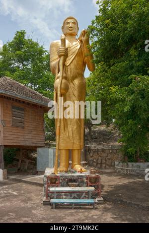Wat Khao Takiap in Hua Hin with a standing Buddha statue. Stock Photo