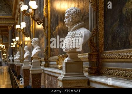 A row of military busts in front of paintings at the Gallery of Great Battles, Palace of Versailles, France Stock Photo