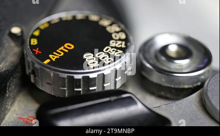 Viersen, Germany - June 9. 2023: Closeup of shutter speed dial, film advance lever and button of old sevenites analog camera Stock Photo