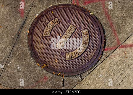Manhole Cover in Detroit, United States. Public Lighting Department Stock Photo