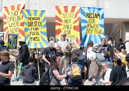 San Francisco, CA - April 21, 2023: Unidentified participants of Youth vs Apocalypse Climate protest in front of the Superior Courthouse. Stock Photo