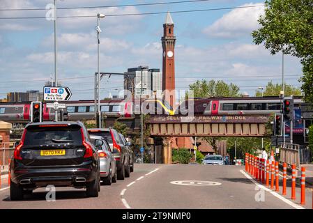 Selly Oak railway bridge, Birmingham, West Midlands, UK with Old Joe clock tower at the University of Birmingham beyond Stock Photo