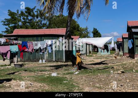 El Seibo, Dominican Republic. 21st Nov, 2023. A little girl brushes her hair in a batey, or community, in El Seibo, Dominican Republic on Nov. 21, 2023. Most residents of these communities are either undocumented Haitian immigrants or denationalized Dominicans of Haitian descent. The United States blocked the Central Romana Corporation, Ltd. from importing sugar into the country on Nov. 23, 2022 after allegations of forced labor were levied against the company. (Photo by Carlos Berríos Polanco/Sipa USA) Credit: Sipa USA/Alamy Live News Stock Photo