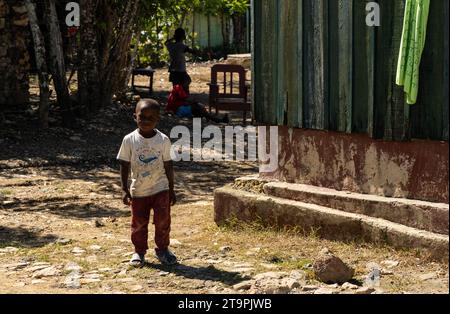 El Seibo, Dominican Republic. 21st Nov, 2023. A child walks through a batey, or community, in El Seibo, Dominican Republic on Nov. 21, 2023. Most residents of these communities are either undocumented Haitian immigrants or denationalized Dominicans of Haitian descent. The United States blocked the Central Romana Corporation, Ltd. from importing sugar into the country on Nov. 23, 2022 after allegations of forced labor were levied against the company. (Photo by Carlos Berríos Polanco/Sipa USA) Credit: Sipa USA/Alamy Live News Stock Photo