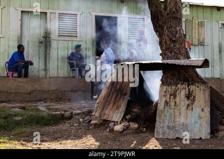 El Seibo, Dominican Republic. 21st Nov, 2023. Residents of a batey, or community, relax while their food cooks in a makeshift oven in El Seibo, Dominican Republic on Nov. 21, 2023. Most residents of these communities are either undocumented Haitian immigrants or denationalized Dominicans of Haitian descent. The United States blocked the Central Romana Corporation, Ltd. from importing sugar into the country on Nov. 23, 2022 after allegations of forced labor were levied against the company. (Photo by Carlos Berríos Polanco/Sipa USA) Credit: Sipa USA/Alamy Live News Stock Photo