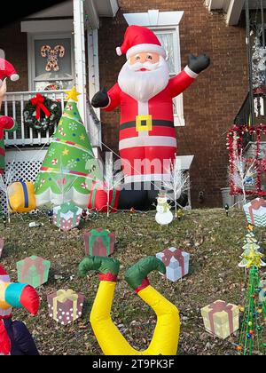 USA. 20th Dec, 2022. Towson, Maryland, USA. Holiday decorations. Christmas display in the lawn. Inflatable Santa, inflatable tree, inflatable fallen elf, candle canes, wreath and snowman. Photo Credit: Robyn Stevens Brody/Sipa USA. Credit: Sipa USA/Alamy Live News Stock Photo