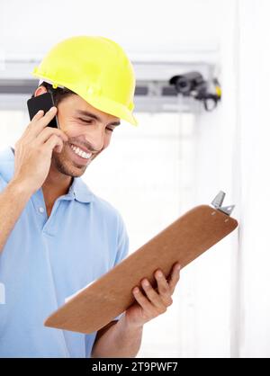 Technician, happy and phone call for security camera, checklist and CCTV installation or services in home. Man or contractor reading clipboard for Stock Photo
