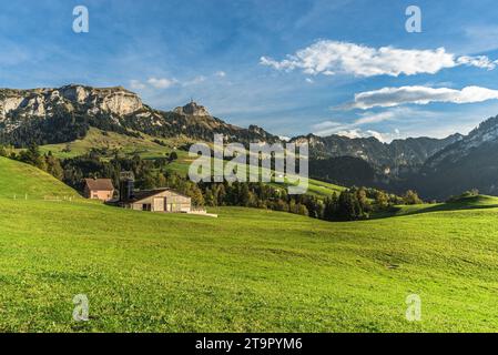 Appenzellerland, landscape with farms and green meadows, view of Hoher Kasten in the Alpstein mountains, Bruelisau, Canton Appenzell, Swittzerland Stock Photo