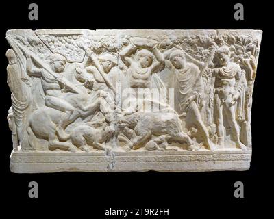 Roman age sarcophagus of Hippolytus and Phaedra. Hippolytus, together with his companions, is portrayed on horseback pointing his spear at the boar. White marble with bluish veins (3rd century BC) - Cattedrale di San Gerlando (Agrigento Cathedral) - Sicily, Italy Stock Photo