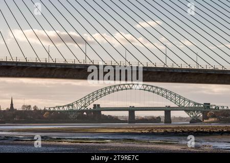 The Mersey Gateway Bridge (2017) with the Silver Jubilee Bridge (1961) behind. Both bridges cross the River Mersey and the Manchester Ship Canal Stock Photo