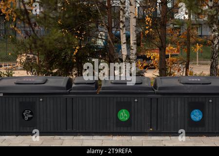 photo of a city street remains clean and tidy with strategically placed trash containers. These bins serve as guardians of the environment, efficiently m Stock Photo