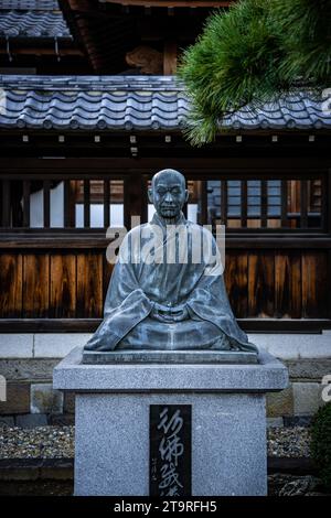 The Statue of an ancient Japanese Buddhist monk and hero at Sengakuji Buddhist Temple in Tokyo Japan. Stock Photo