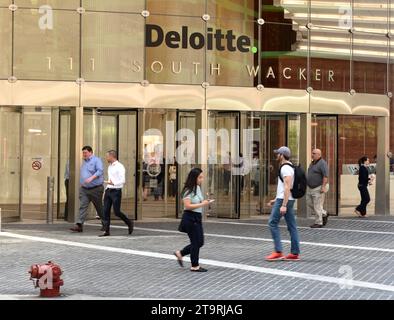 Chicago, USA - June 06, 2018:People near the office Deloitte company (Deloitte Touche Tohmatsu Limited) in Chicago, Illinois. Stock Photo