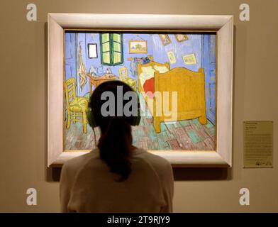 Chicago, USA - June 06, 2018: Woman look at the The Bedroom by Vincent van Gogh painting in Art Institute of Chicago. Stock Photo