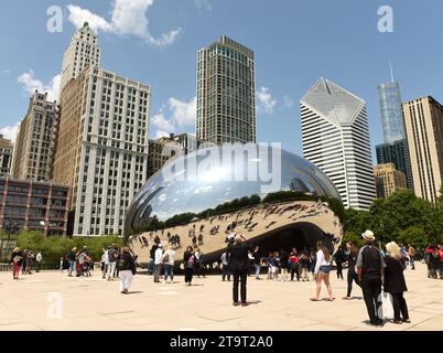 Chicago, USA - June 05, 2018: People near the Cloud Gate, a public sculpture by Anish Kapoor at Millennium Park. Cloud Gate, also known as the Bean on Stock Photo