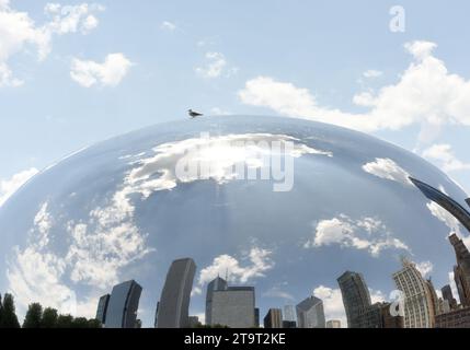 Chicago, USA - June 05, 2018: Reflection in the Cloud Gate also known as the Bean in Millennium Park in Chicago, Illinois. Stock Photo