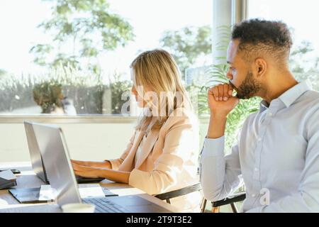 Two work colleagues working in the office. Business concept. Stock Photo