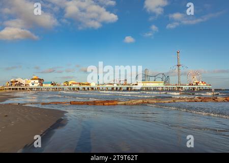 Galveston, USA - October 28, 2023: Pleasure Pier from the water in Galveston Island in afternoon light, Texas, USA. Stock Photo