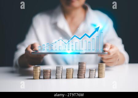 Interest rate and dividend concept, Businessman is calculating income and return on investment in percentage. income, return, retirement, compensation Stock Photo