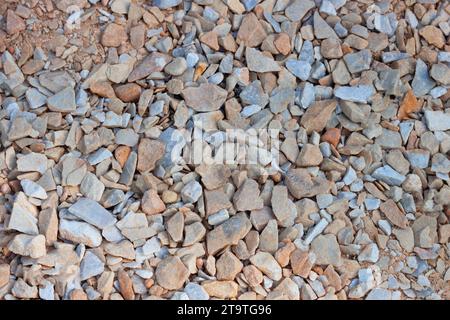 Crushed stone brown gray background texture, top view. Natural stone gravel. AI generated. Header banner mockup with copy space. Stock Photo