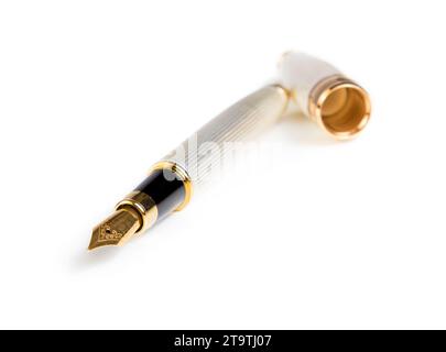 elegant gold business fountain pen isolated on white background with space for text Stock Photo