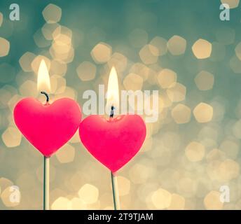 hearts candles on vintage bokeh as background vintage style, valentine day and love concept Stock Photo