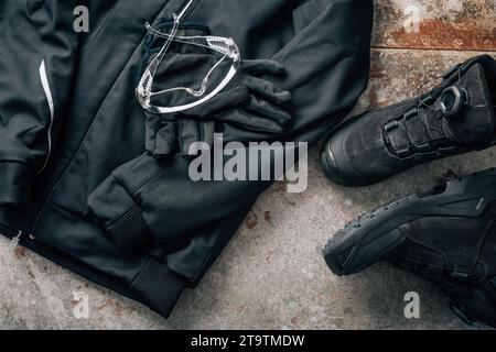 Workwear for craftsman with jacket, safety footwear, gloves and goggles Stock Photo