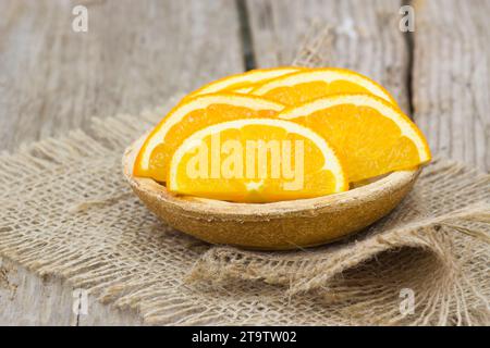 fresh tangerines on a plate on old wooden background Stock Photo
