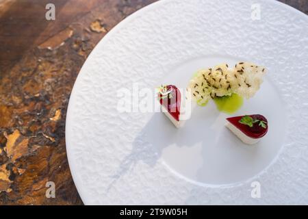 Elegant Culinary Presentation of a luxury appetizer on a white plate in restaurant. Food Photography Concept image Stock Photo