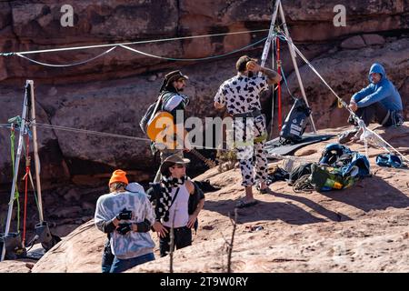 Participants gear up to walk the highlines at the GGBY Highline Festival in Moab, Utah. Stock Photo