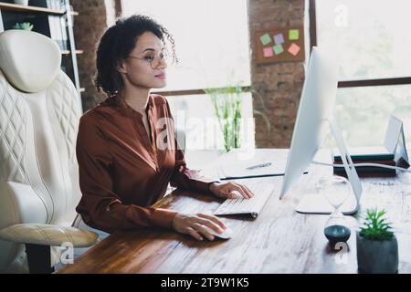 Profile portrait of elegant pretty recruiter lady sitting chair coworking computer spacious modern office inside Stock Photo