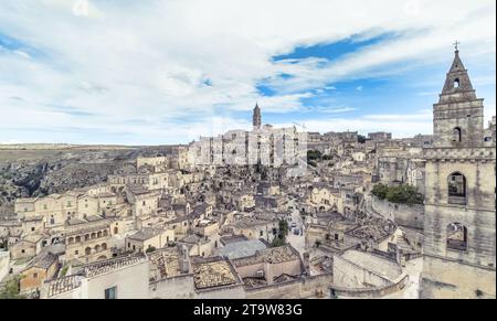 panoramic view of typical stones (Sassi di Matera) and church of Matera under blue sky, artistic style. Matera in Italy UNESCO European Capital of Culture 2019 Stock Photo