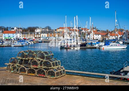 Lobster pots on quayside of marina at Scottish coastal town of Anstruther in East Neuk of Fife, Scotland, UK Stock Photo