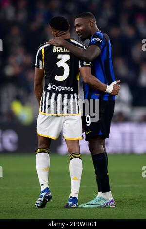 Turin, Italy. 26 November 2023. Marcus Thuram of FC Internazionale hugs Gleison Bremer of Juventus FC during the Serie A football match between Juventus FC and FC Internazionale. Credit: Nicolò Campo/Alamy Live News Stock Photo