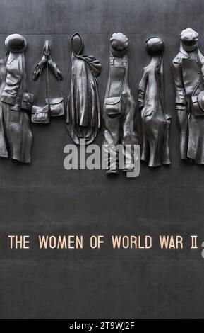 Clothing carvings on the cenotaph memorial to women of world war II, Whitehall, London, England, November 2023. Stock Photo