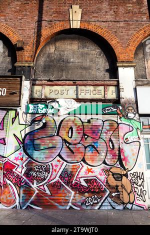 Abandoned and boarded up former post office building along Burdett Road in Mile End - an area undergoing gentrification and development, Tower Hamlets Stock Photo