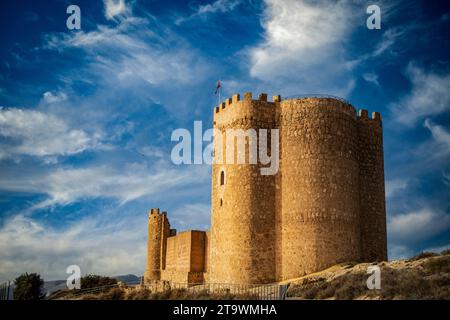 General view of Jumilla Castle, Murcia, Spain, with the imposing tower in the foreground and in daylight Stock Photo