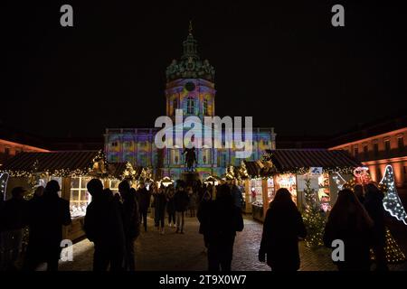 November 27, 2023, marks the opening of Berlin's beloved Christmas markets, with the Weihnachtsmarkt am Schloss Charlottenburg taking center stage. This iconic market, set against the romantic backdrop of Charlottenburg Palace, is renowned for its majestic illuminations and draws both locals and tourists alike. Charlottenburg Palace becomes a winter wonderland, bathed yearly in romantic and colorful lights. The market avoids plastic decorations, opting for natural materials to create a nostalgic atmosphere. The season will see nearly 100 Christmas markets throughout Berlin, each with its uniqu Stock Photo